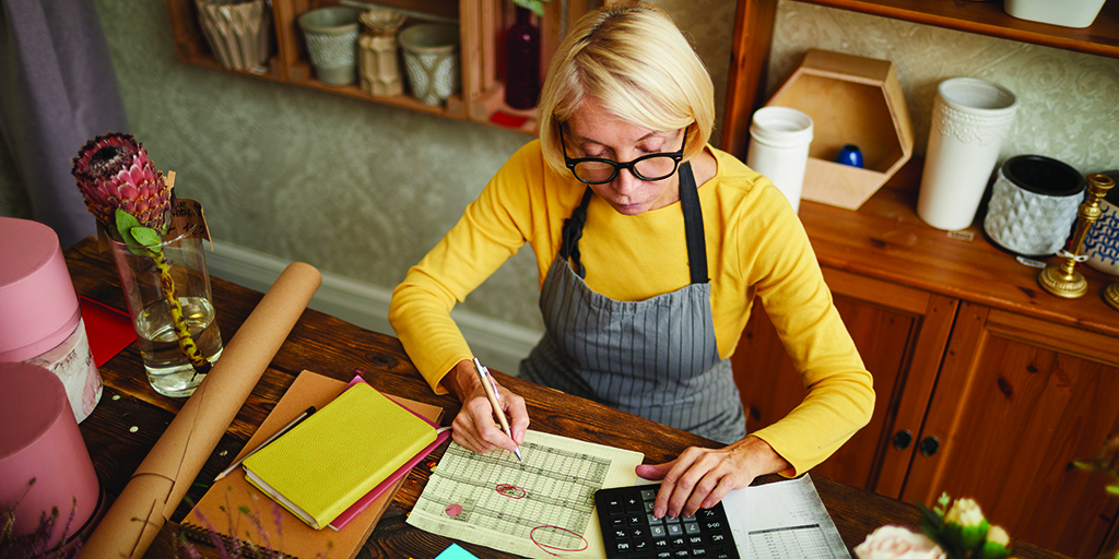 An image of a bookkeeper making calculations